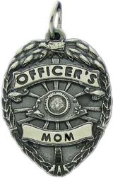 police badge charm in sterling silver with an oxidized finish
