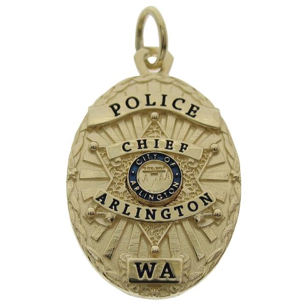Custom Arlington WA Police Chief badge pendant in 14k yellow gold with blue and black enamel.