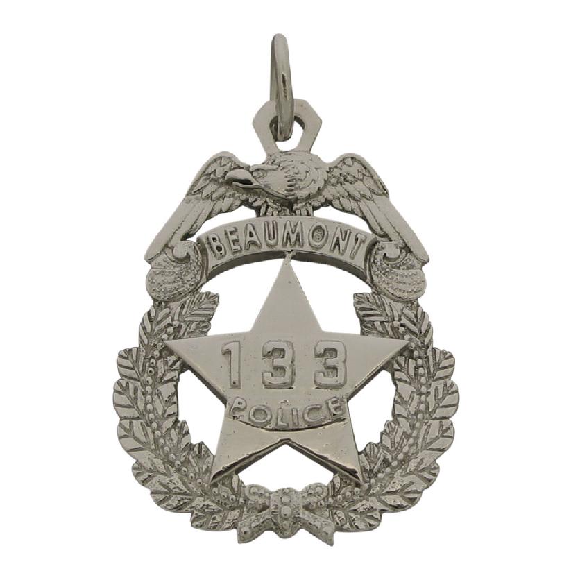 Custom Beaumont (TX) Police Officer badge pendant in 10k white gold with raised letters and badge number.