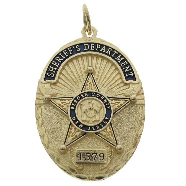 Custom Bergen County NJ Sheriff's Department badge pendant in 14k gold with blue enamel.
