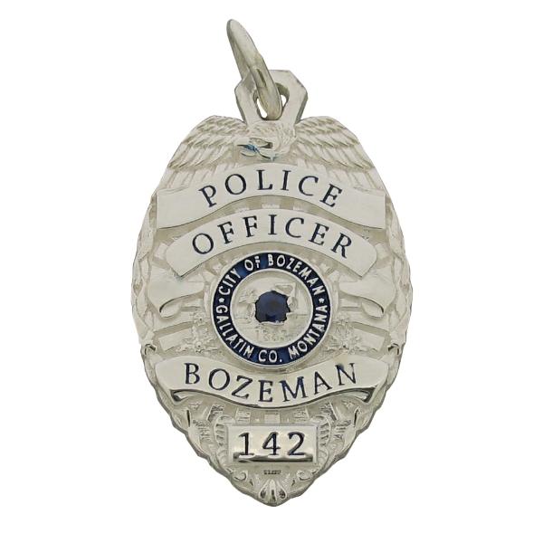 Custom Bozeman MT Police Officer badge pendant in sterling silver with optional blue sapphire center stone and enamel.