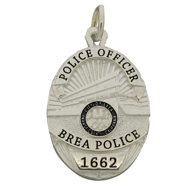 Custom Brea CA Police Officer badge pendant in sterling silver with black enamel.