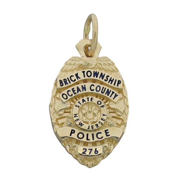 Custom Brick Township NJ Police Officer badge pendant in 14k yellow gold with black enamel.