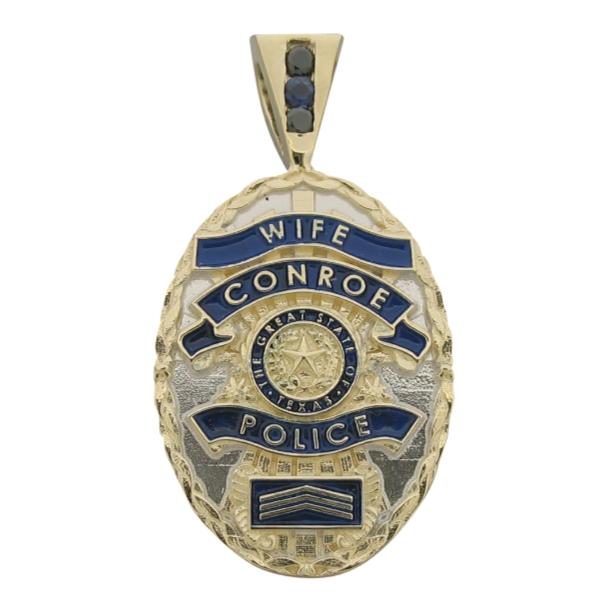 Custom Conroe TX Police Sergeant badge pendant in 14k gold with a two tone finish, blue enamel, and a 3-stone bail with blue sapphires and a black faceted stone in the 3-stone bail.