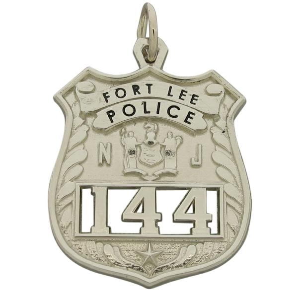 Custom Fort Lee (NJ) Police Officer badge pendant in 10k white gold with cutout numbers and black enamel.