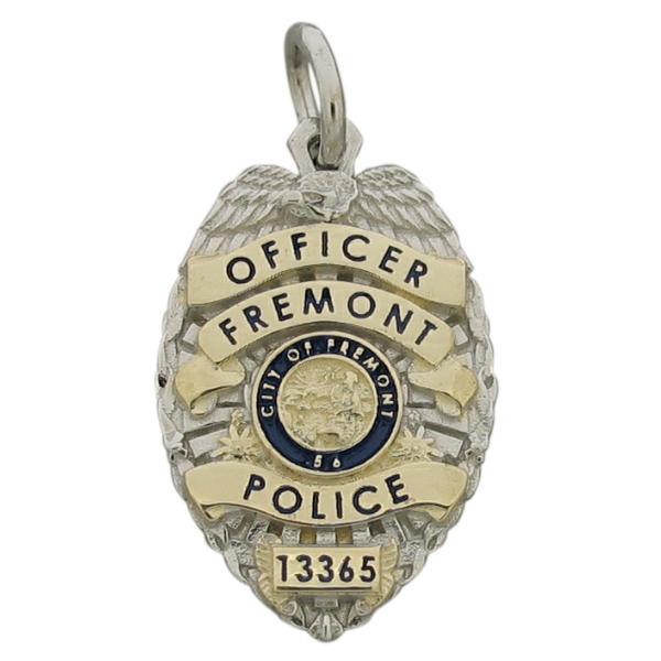 Custom Freemont CA Police Officer badge pendant in two tone 10k gold with blue and black enamel.