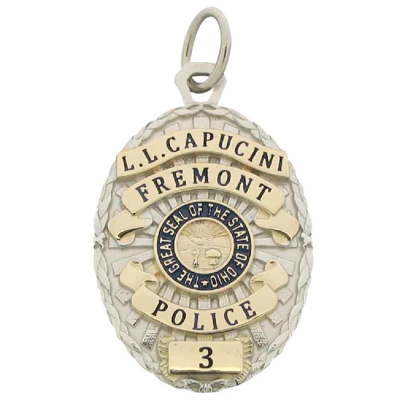 Custom Fremont OH Police Officer badge pendant in 10k yellow gold with rhodium plate two tone finish and blue and black enamel.