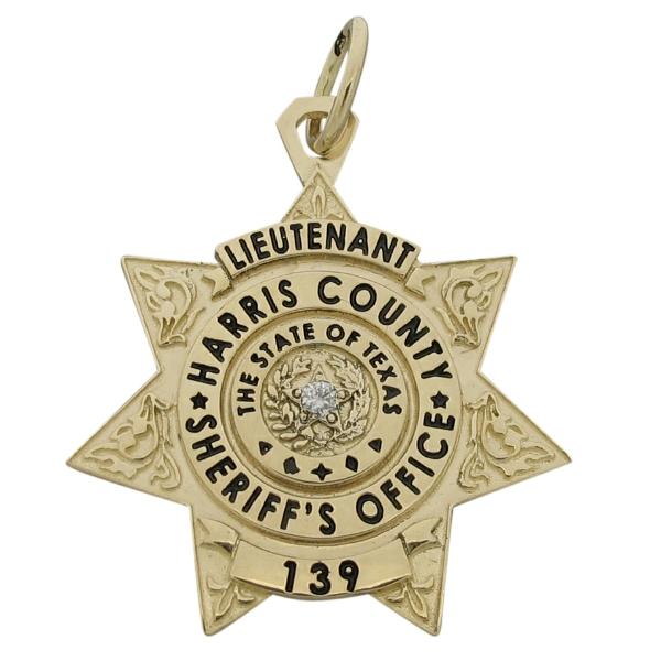 Custom Harris County TX Sheriff's Lieutenant badge pendant in 14k yellow gold with a 0.03 ct. diamond and black enamel.