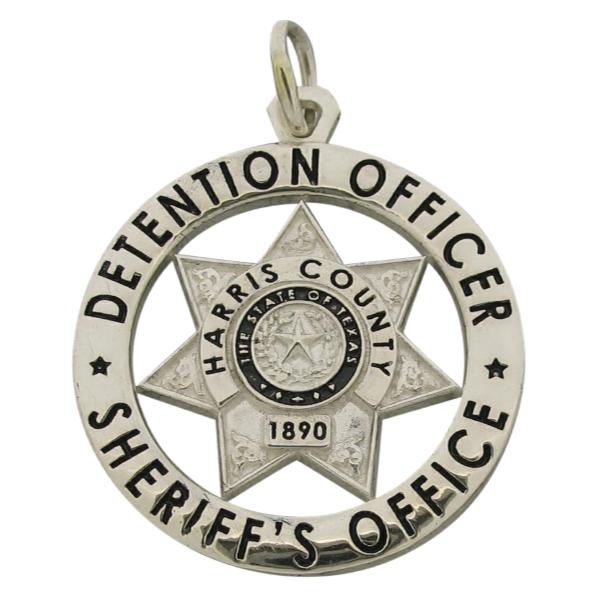 Custom Harris County TX Sheriff's Detention Officer badge pendant in sterling silver with black enamel.