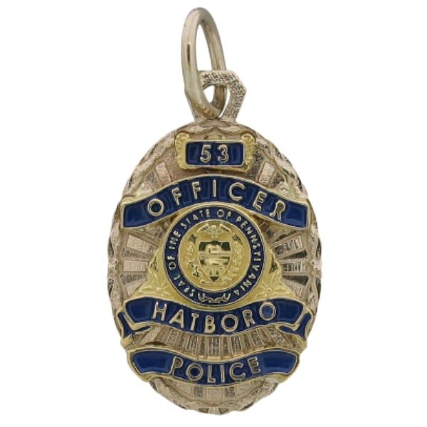 Custom Hatboro PA Police Officer badge pendant in 18k white and yellow gold with optional standing letter detail and blue enamel background.