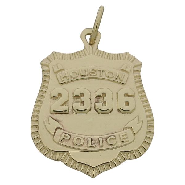 Custom Houston TX Police Officer memorial badge pendant in 10k yellow gold with raised numbers and text.