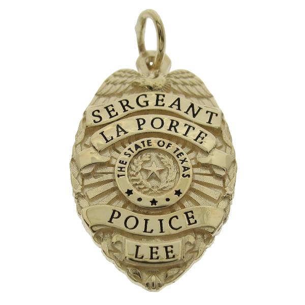 Custom La Porte TX Police Lieutenant badge pendant in 10k yellow gold with black enamel.