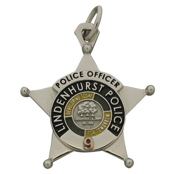 Custom Lindenhurst IL Police Officer badge pendant in 10k white gold with rose gold plated number and black, green, and gold enamel.