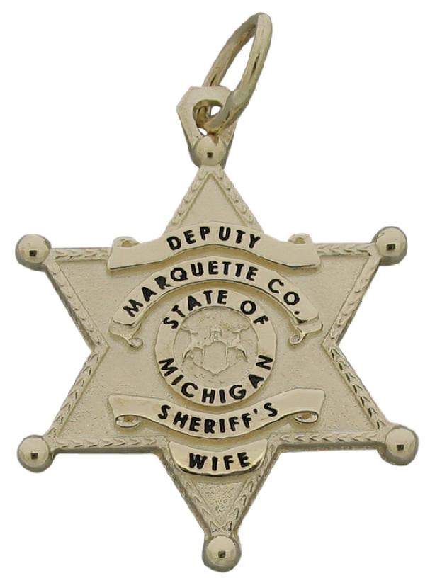 Custom Marquette (MI) Sheriff's Deputy badge pendant in 10k yellow gold with black enamel text.