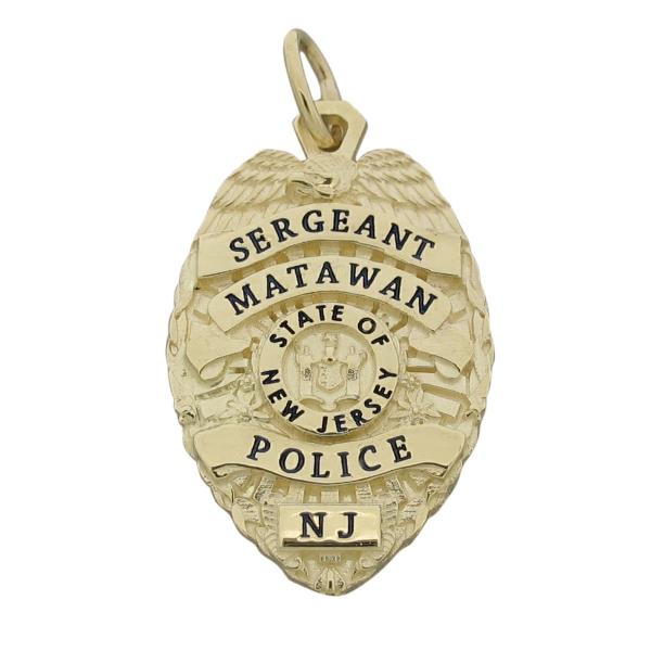 Custom Matawan NJ Police Officer badge pendant in 10k yellow gold with black enamel.