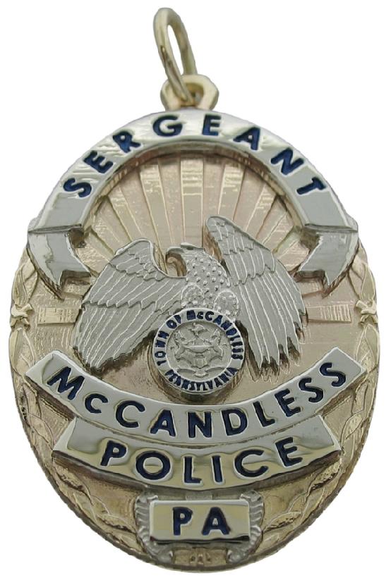 Custom McCandless, PA Police Sergeant badge pendant in 10k yellow and white gold assembled. Black enamel text.
