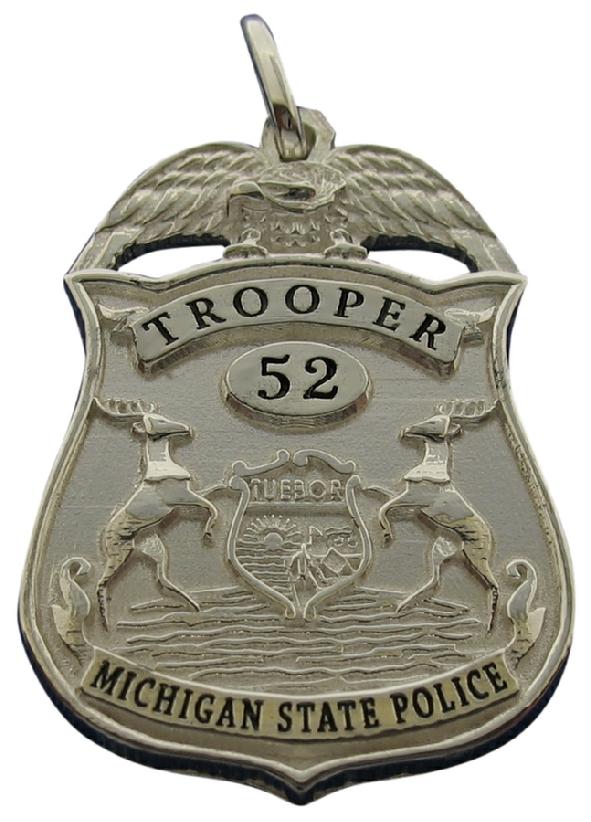 Custom Michigan State Police Trooper badge pendant in sterling silver with black enamel.