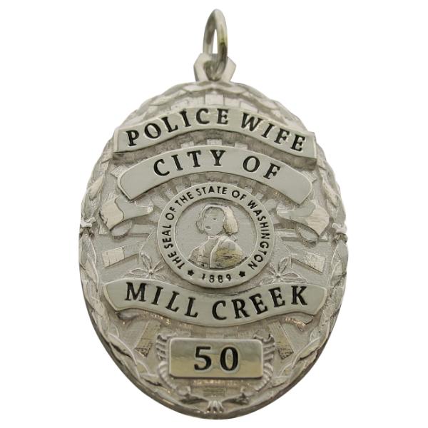 Custom Mill Creek WA Police Officer badge pendant in sterling silver with black enamel text.
