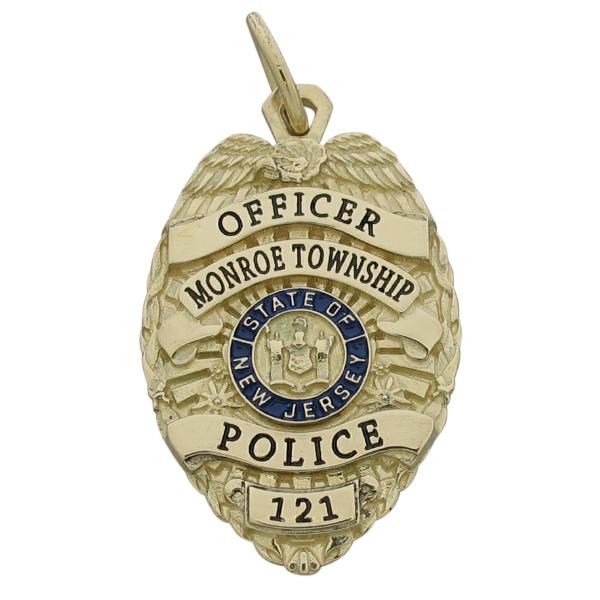 Custom Monroe NJ Township Police Officer badge pendant in 10k yellow gold with blue and black enamel.