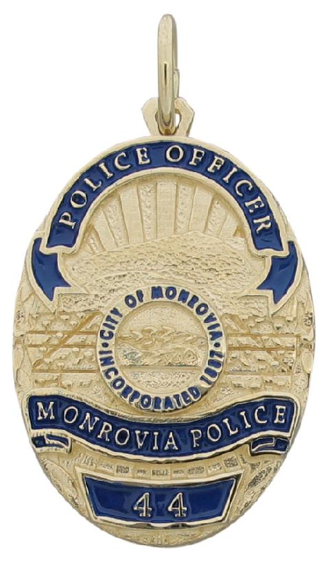 Custom Monrovia (CA) Police Officer badge pendant in 14k yellow gold with standing and engraved text and blue enamel background.