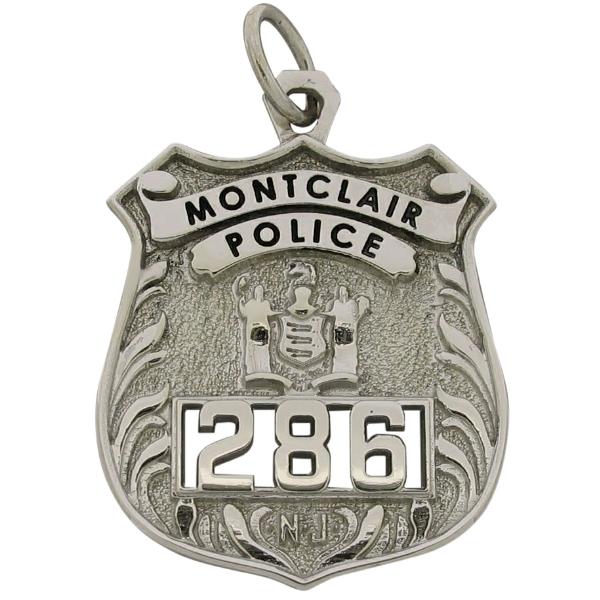 Custom Montclair NJ Police Officer badge pendant in 10k white gold with black enamel and cutout badge number.