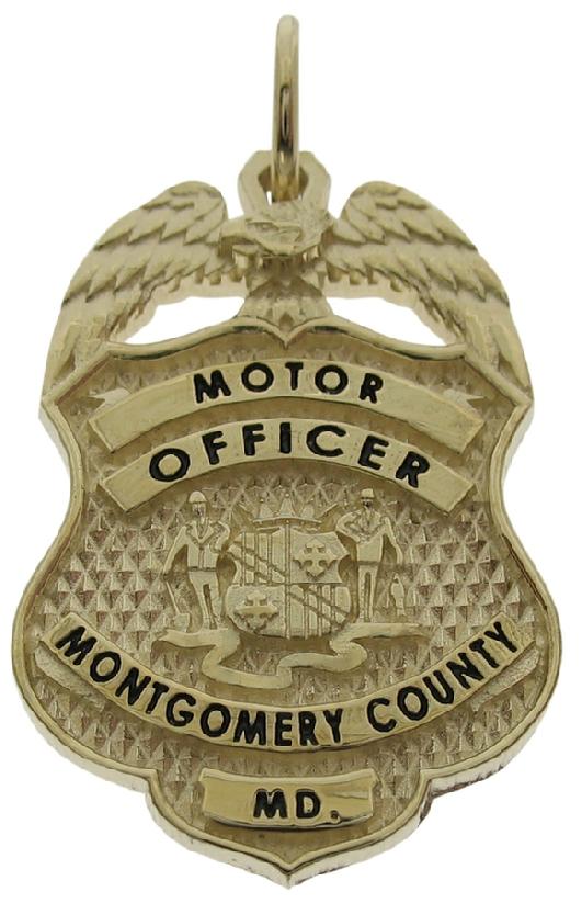 Custom Montgomery County MD Police Motor Officer badge pendant in 10k yellow gold with black enamel text.