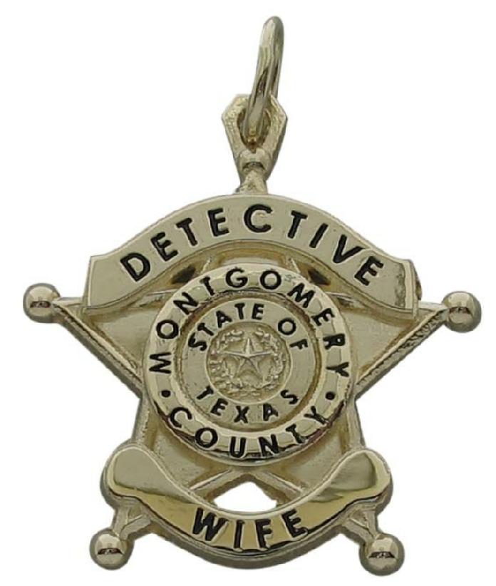 Custom Montgomery County, TX Sheriff's Detective badge pendant in 14k yellow gold with black enamel text.