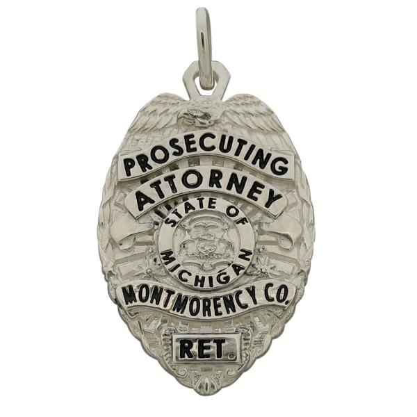 Custom Montmorency County MI Prosecuting Attorney badge pendant in sterling silver with black enamel.