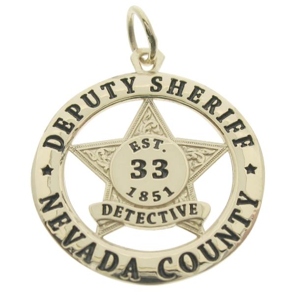 Custom Nevada Count CA Sheriff's Deputy badge pendant in 14k yellow gold with black enamel.