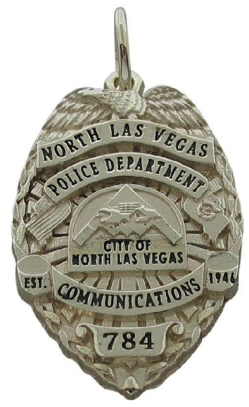 Custom North Las Vegas, NV Police Communications badge pendant in 18k white gold with black text.