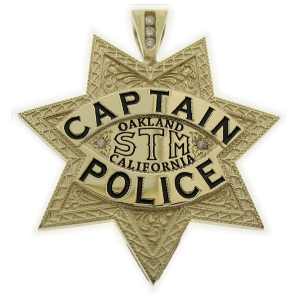 Custom Oakland CA Police Captain badge pendant in 10k yellow gold with optional 3-diamond bail and black enamel.