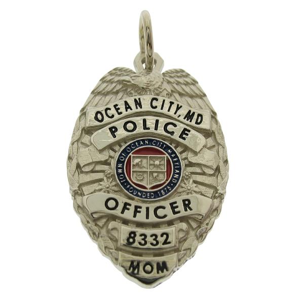 Custom Ocean City MD Police Officer badge pendant in 10k white gold with red and blue enamel and standing letter seal bezel.