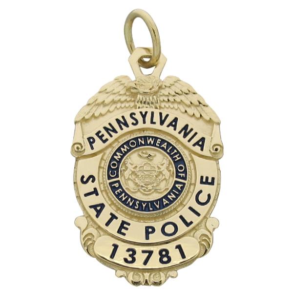 Custom Pennsylvania State Police badge pendant in 14k yellow gold with blue and black enamel.