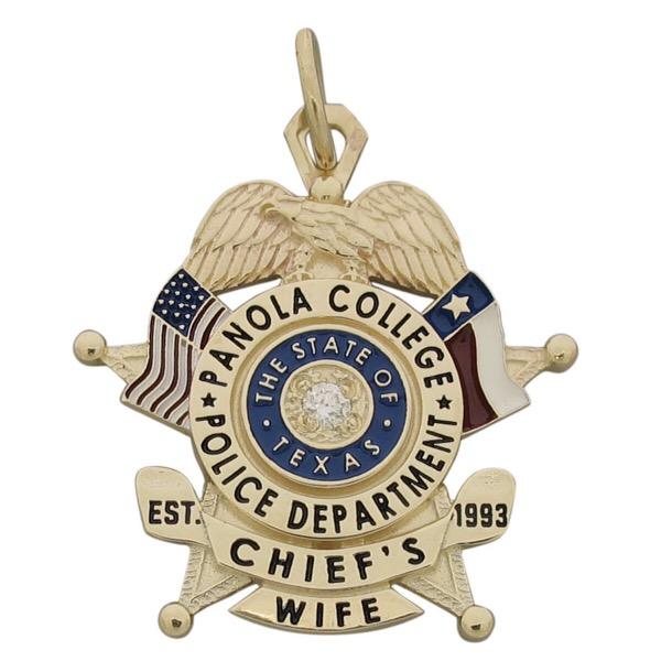 Custom Panola College TX Police Chief badge pendant in 10k yellow gold with red, white, & blue flags, black enamel text, and 0.05 ct. round brilliant diamond center.
