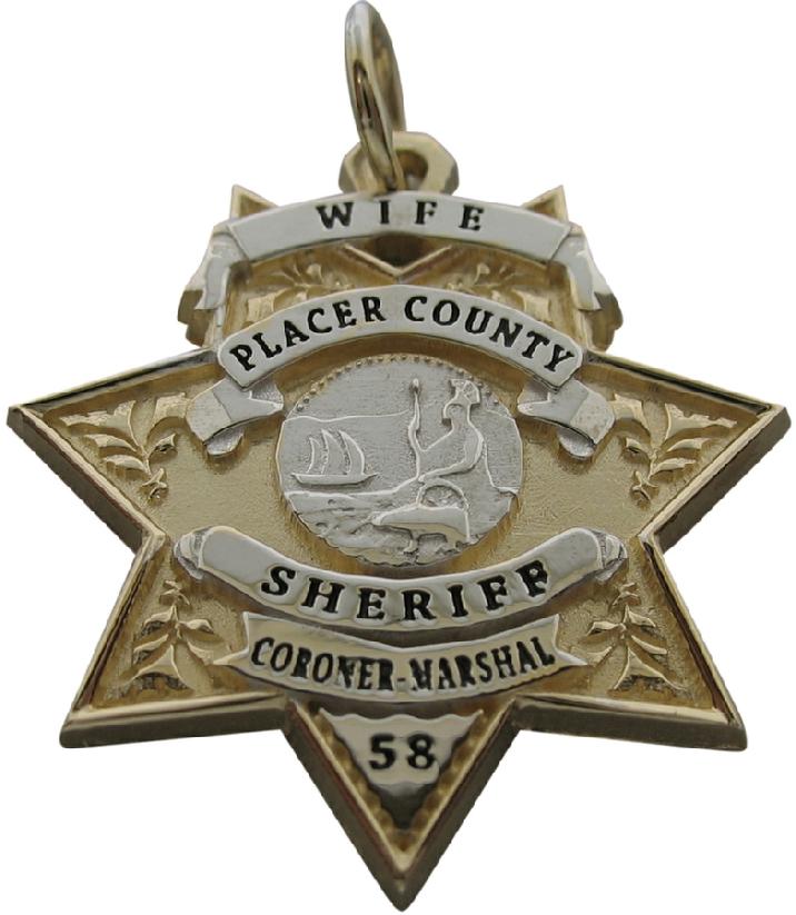 Custom Placer County, CA Sheriff badge pendant in 14k yellow gold with rhodium plated ribbons and seal. Black enamel text.