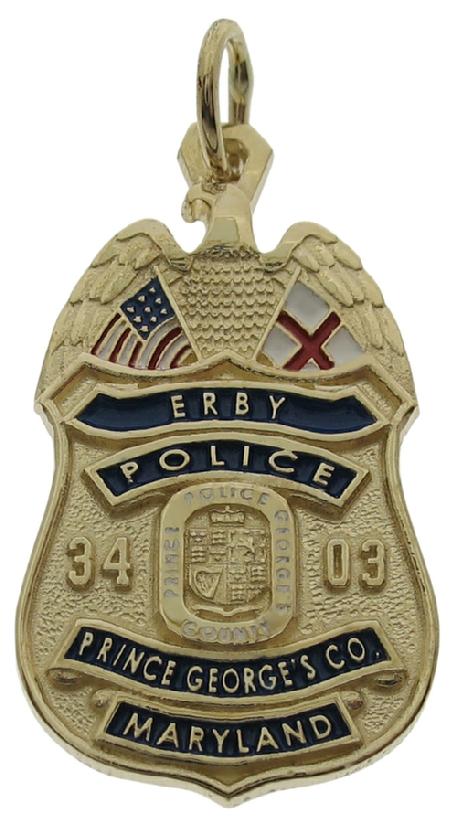 Custom Prince George's MD Police Officer badge pendant in 14k yellow gold with raised letter text and details, and red, white, and blue enamel details,