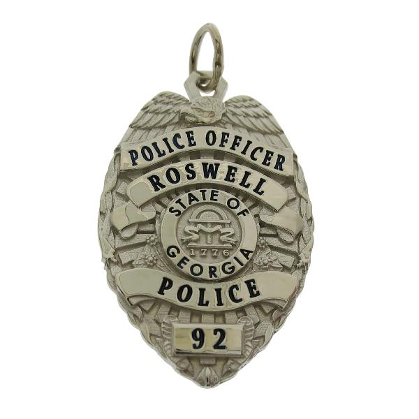 Custom Roswell GA Police Officer badge pendant in 10k white gold with black enamel.