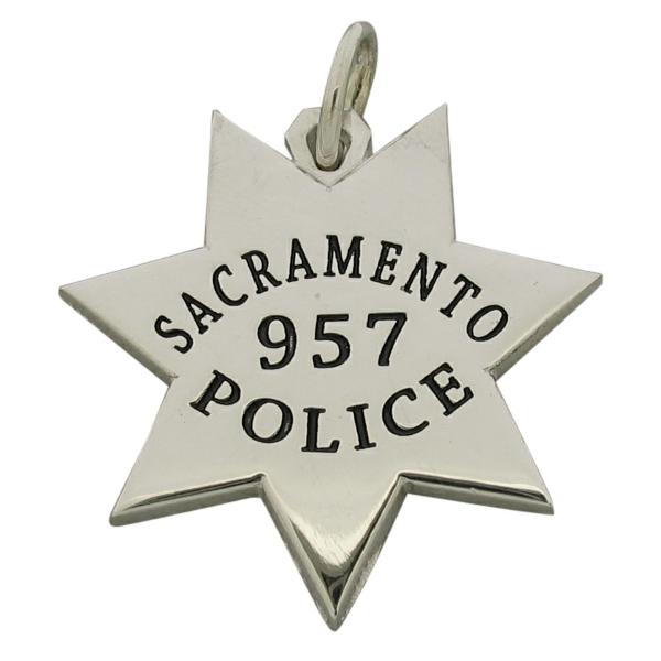 Custom Sacramento CA Police Officer badge pendant in sterling silver with black enamel.