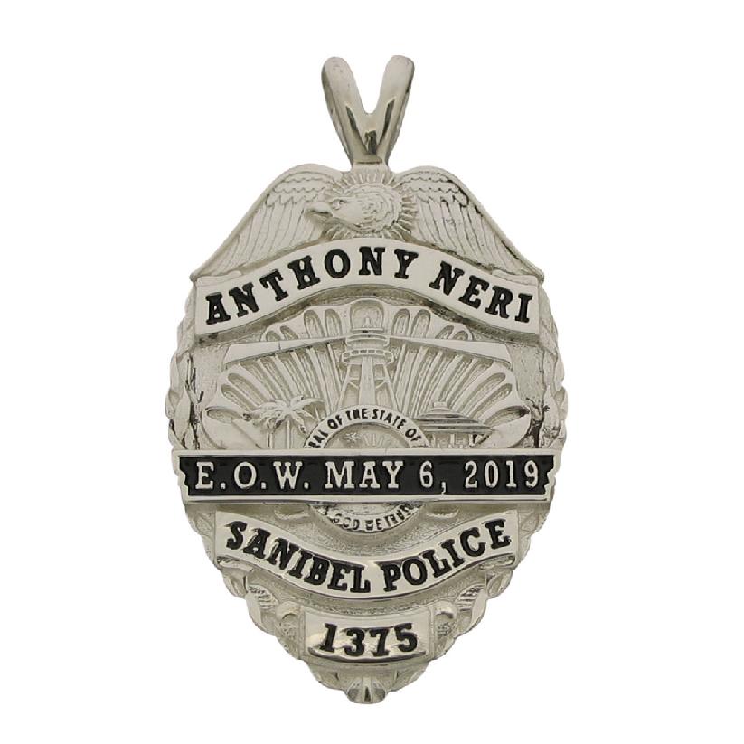 Custom Sanibel (FL) Police Officer memorial badge pendant with mourning ribbon and black enamel.