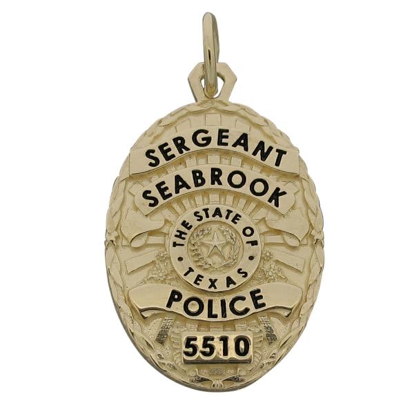 Custom Seabrook TX Police Sergeant badge pendant in 14k yellow gold with black enamel.
