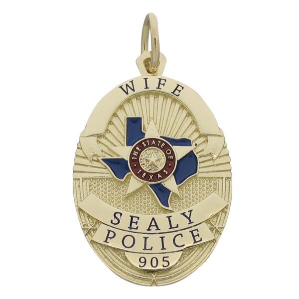 Custom Sealy TX Police Officer badge pendant in 10k yellow gold with red and blue enamel.
