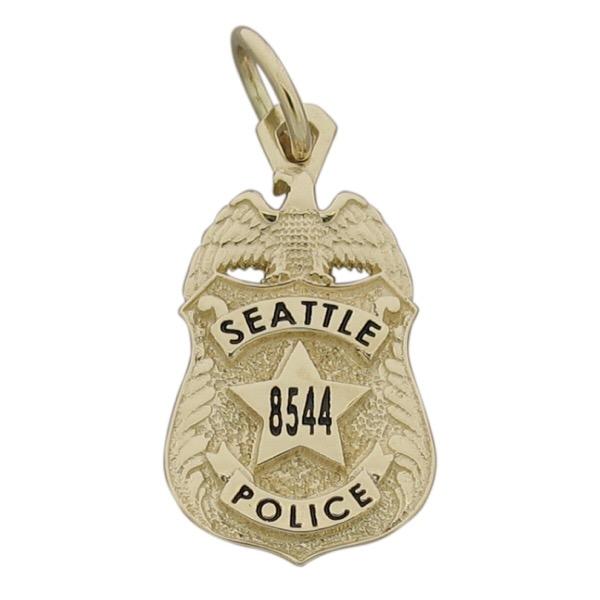 Custom Seattle WA Police Officer badge pendant in 10k yellow gold with black enamel.