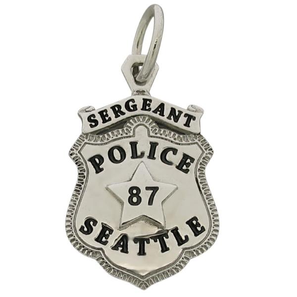 Custom Seattle WA Police Sergeant badge pendant in sterling silver with black enamel.