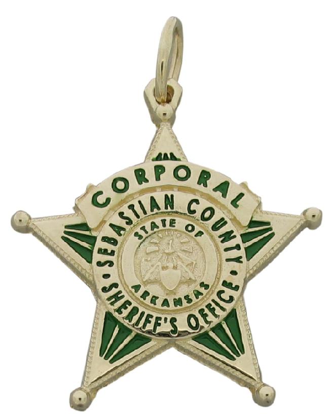 Custom Sebastian County (AR) Sheriff Corporal memorial badge pendant in 10k yellow gold with green enamel.