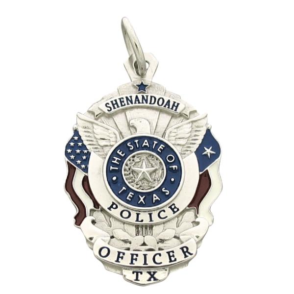 Custom Shenandoah TX Police Officer badge pendant in 14k white gold with red, white, and blue flags and black enamel text.