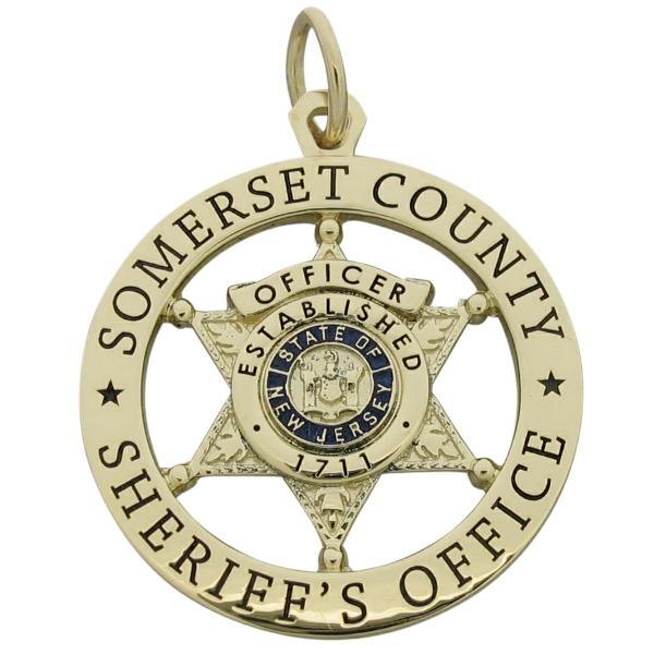 Custom Somerset County NJ Sheriff's Officer badge pendant in 10k yellow gold with enamel.