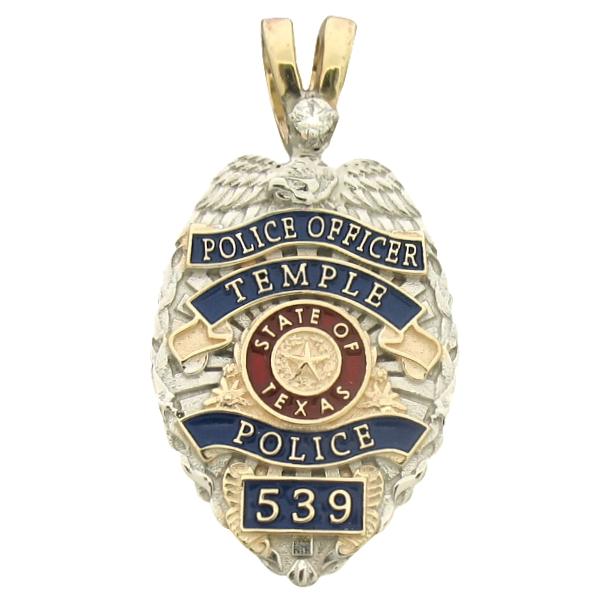 Custom Temple TX Police Officer badge pendant in 10k yellow gold with rhodium two tone finish, red and blue enamel, and a 0.05ct. diamond in the "V" bail.