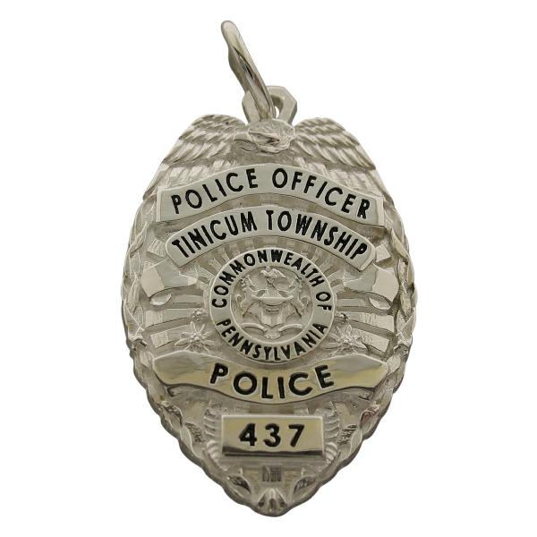 Custom Tinicum Twp. PA Police Officer badge pendant in sterling silver with black enamel.
