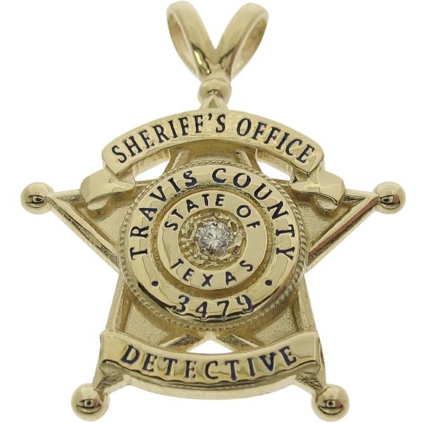 Custom Travis County TX Sheriff Detective badge pendant in 14k yellow gold with 0.05 ct. round brilliant diamond and black enamel text.