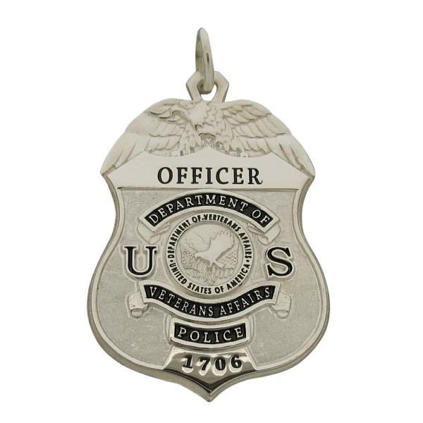 Custom U.S. Dept. of VA Police Officer badge pendant in sterling silver with raised letter detail and black enamel.